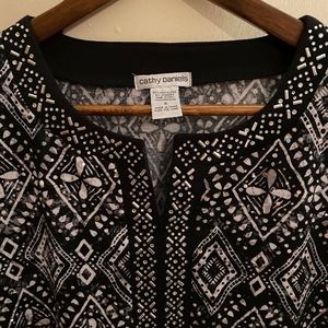 Black, with white diamond shapes, blouse.